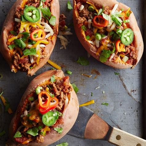 Scoop some rice/grains into each, then pile on the roasted sweet potatoes and broccoli. Chili-Topped Sweet Potatoes Recipe - EatingWell