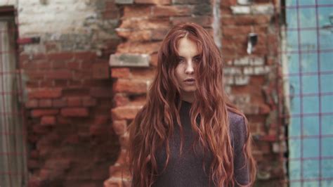 Portrait Of A Young Red Haired Witch Her Hair Rising Up And Stands On