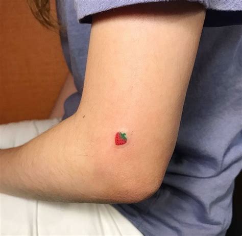 Strawberry tattoo has various meanings, but the famous one symbolizes love, romance, passion, and pure feeling for someone. #tattoo #strawberry | Cute tiny tattoos, Simplistic ...