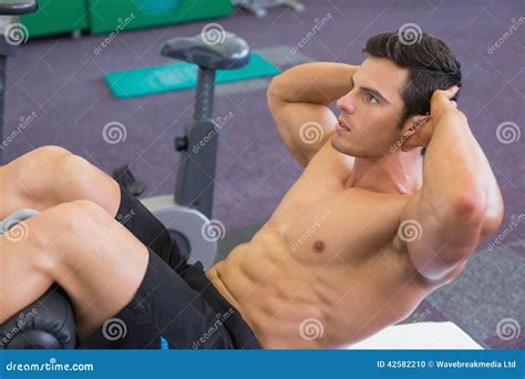 Muscular Man Doing Abdominal Crunches In Gym Stock Photo Image Of