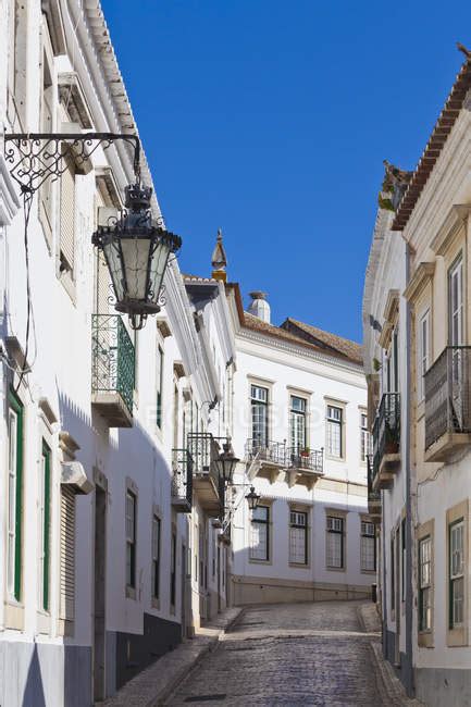 Portugal Faro View Of Typical Old Town Street With White Houses