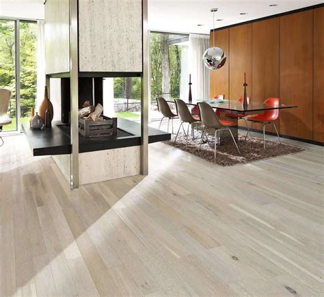 Laminate, on the other hand, layers fiberboard and is topped with a photographic image layer to look like hardwood. Kahrs Oak Arctic Engineered Wood Flooring