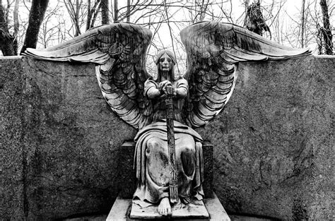 Without any memories, or even a clue as to where she could be, she wanders the building. Angel Of Death Photograph by J Austin