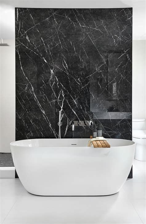 Black marble lines the floors, walls and countertops of this luxurious and traditional bathroom. Master Ensuite Bath Tub with Porcelain Black Marble ...