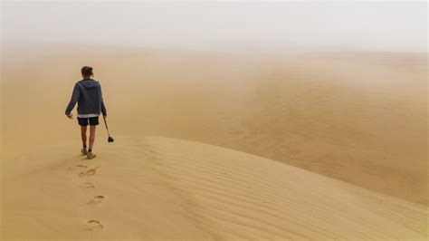 Person Walking Desert Place Photo Free Nature Image On Unsplash