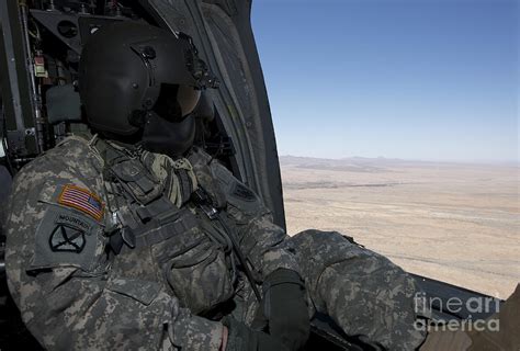 Uh 60 Black Hawk Crew Chief Takes Photograph By Terry Moore