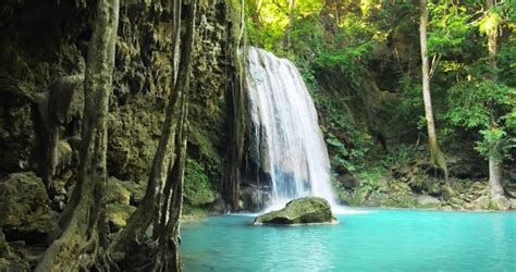 Paradise Jungle Forest With Beautiful Waterfall In Green Lush Of Erawan Park In Kanchanaburi
