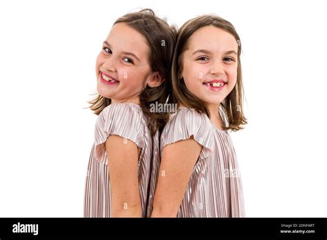 Twin Girls Standing Back Back Hi Res Stock Photography And Images Alamy