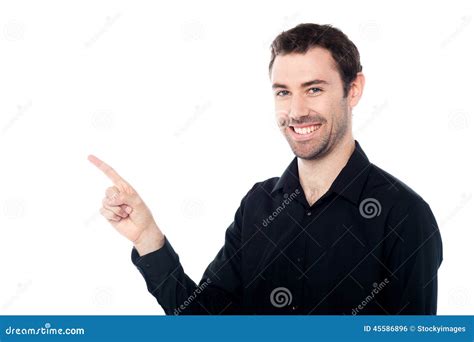 Smiling Young Guy Pointing At Something Stock Photo Image Of Casual
