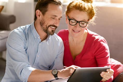 Optimistic Middle Aged Couple Using Laptop At Home Stock Image Image