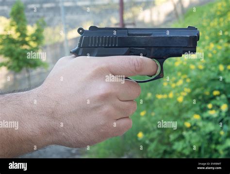 Mans Hand Holding Gun Hi Res Stock Photography And Images Alamy