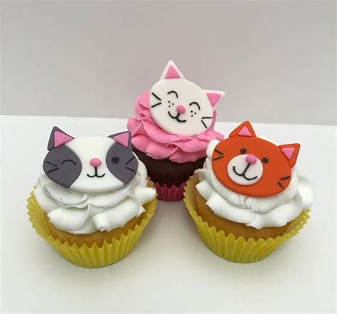 Three Cupcakes Decorated With Cats And Kitten Faces