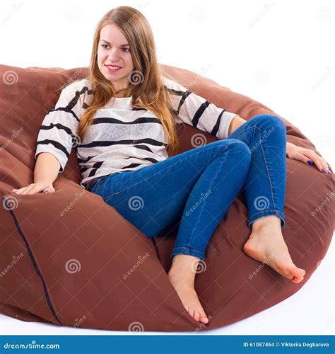 Girl Sitting On A Braun Beanbag Chair Stock Photo Image Of Skinny