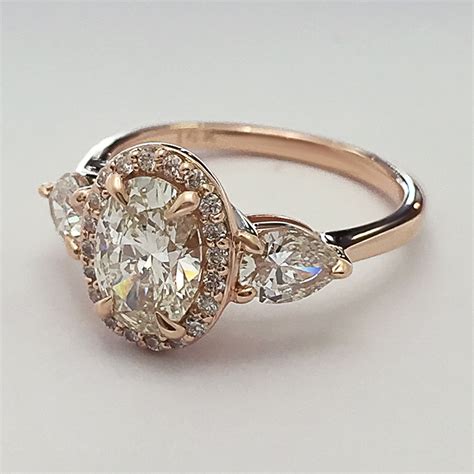 Book an appointment with a diamond expert. Oval Shaped Diamond Engagement Ring with Pear Shaped ...