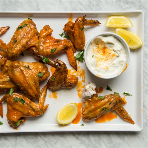 Chicken wings are egged and fried in butter, then baked in a tangy sauce of soy sauce, water, sugar, vinegar, garlic powder and salt. Baked Chicken Wings Recipe - Kay Chun | Food & Wine