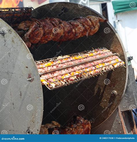 Industrial Rotisserie With Spit Roasted Chickens And Skewers Of Stock