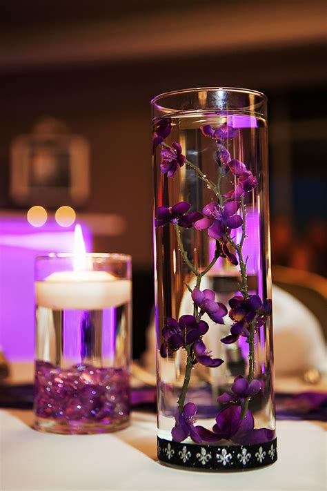 Purple Floating Centerpiece In Cylinder Vase Floating Centerpieces Purple Floating Candles