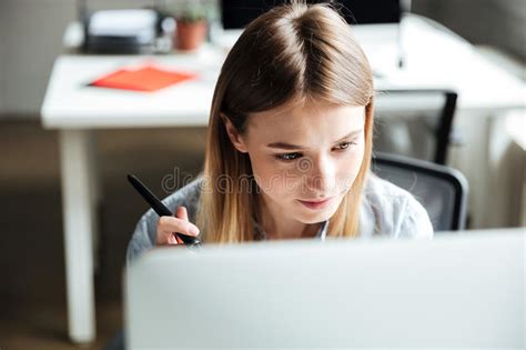 Concentrated Young Woman Work In Office Using Computer Stock Image