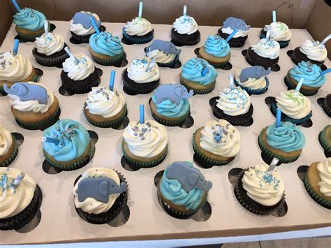 Draw your elephant shape onto tracing paper, fill in with cupcakes and then stick with fondant. Blue white gray elephant theme boy baby shower | Cupcakes for boys, Elephant cupcakes, Baby boy ...