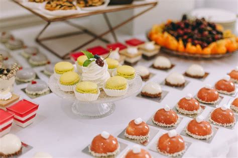 Beautifully Decorated Catering Banquet Table With Burgers Profiteroles