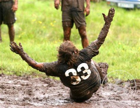 Football In The Mud 33 Photos Thats The Same People Rushing Page 1