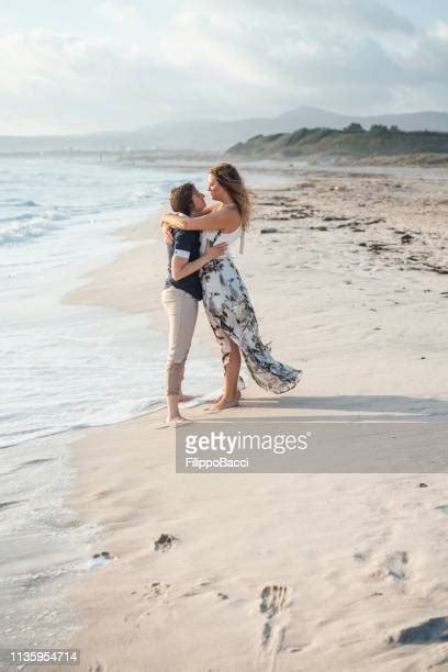 Young Romantic Lesbian Couple Kissing At Sunset On Seaside Photos Et