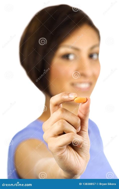 A Young Woman Holds An Orange Pill Stock Image Image Of Brown Hair
