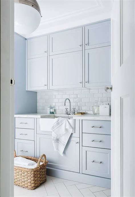 Blue Laundry Room Cabinets with White Subway Tiles  Transitional