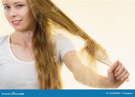 Blonde Girl Brushing Her Long Hair Stock Image Image Of Hair Tangled 166585689