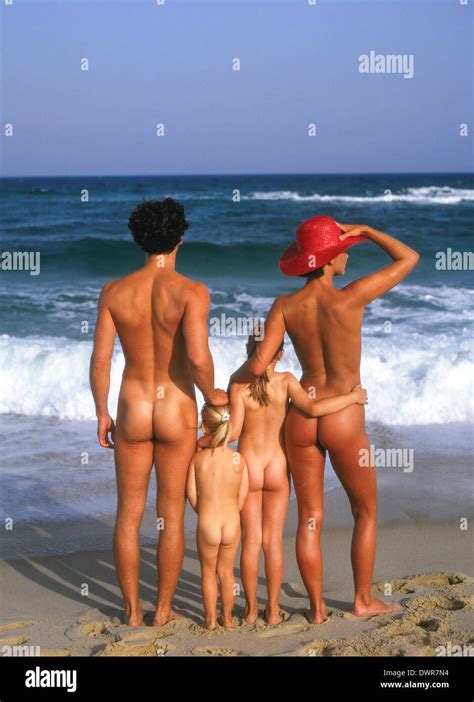 Nudists Family At Summer Vacation On Beach Stock Photo Alamy