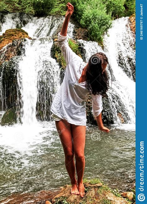 Pretty Brunette Girl In White Shirt Posing In Front Of Waterfall Stock Image Image Of Model