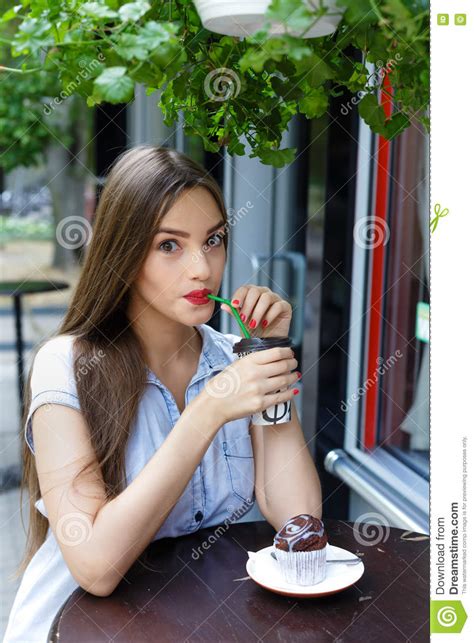 Cheerful Beautiful Girl In Outdoor Cafe Drinking Coffee With Mu Stock Image Image Of Cafe