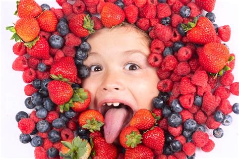 Premium Photo Summer Fruits Berries With Kids Face Closeup Top View