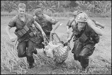 American Soldiers Carrying Wounded Photograph By Bettmann