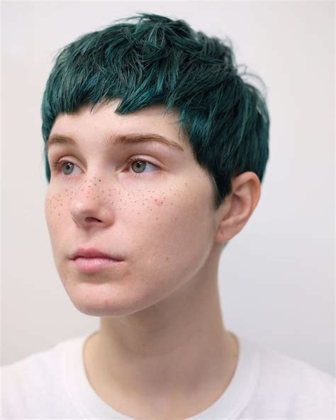 Baby Banged Cropped Pixie With Messy Texture And Dark Jungle Green Hair