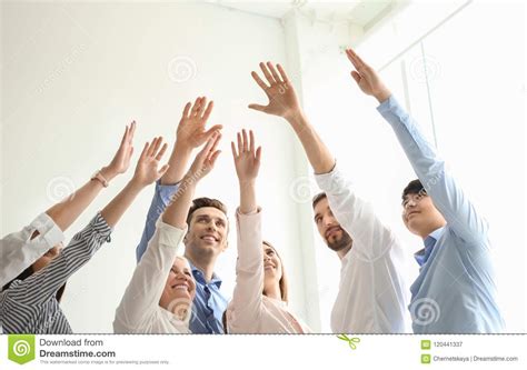 People Raising Hands Together Indoors Stock Image - Image of ...