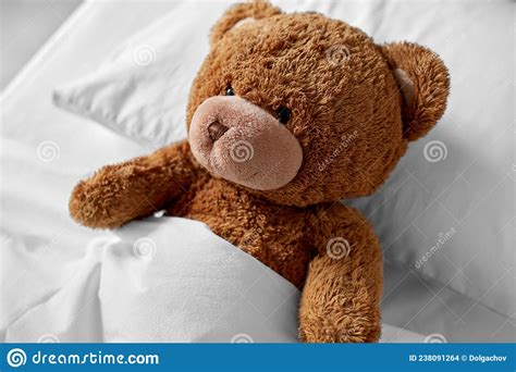 Teddy Bear Toy Lying Covered With Blanket In Bed Stock Photo Image Of