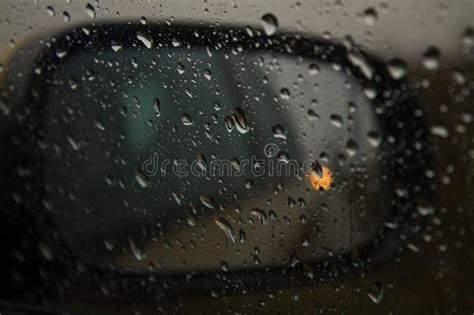 A Car Mirror Through The Window Spattered With Rain Stock Image Image