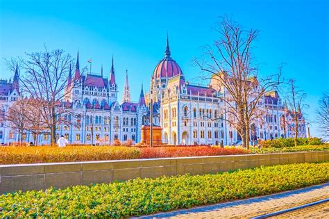 Outstanding Parliament Building Of Budapest Through The Greenery Of