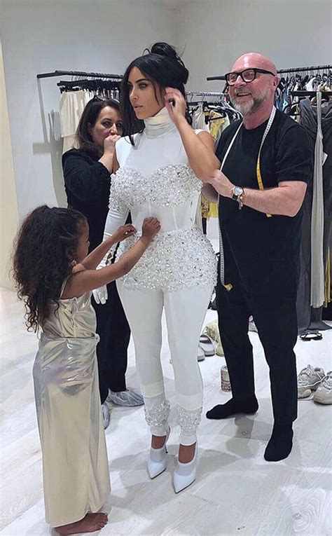 north west tries her hand at high fashion as she helps kim kardashian with a fitting e online