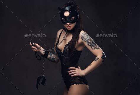 Sexy Woman Wearing Black Lingerie In Bdsm Cat Leather Mask And