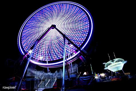 Long Exposure Scene Of A Ferris Wheel Free Image By