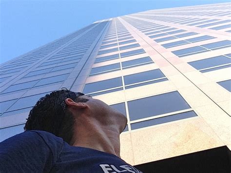Man Looks Up At Tall Building He Arriving At For Interview With Dream