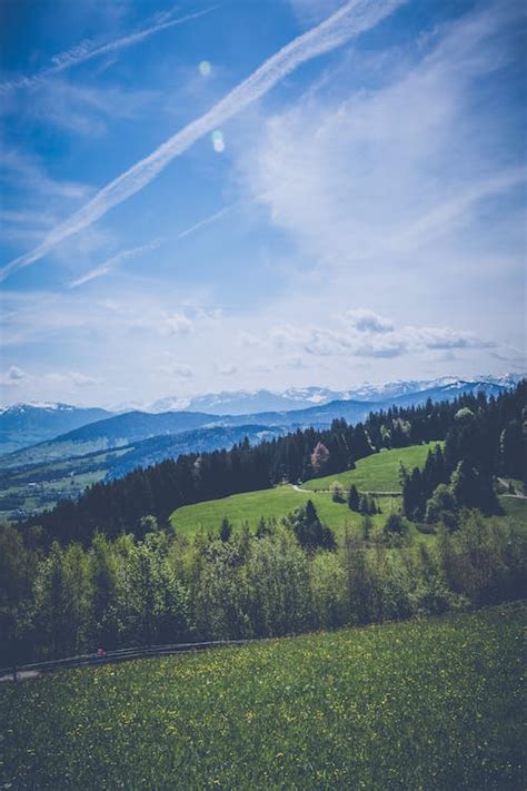 Landscape Photography Of Green Grass Field Mountain · Free Stock Photo