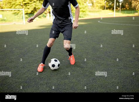 Soccer Player Playing With Ball On Football Field Stock Photo Alamy