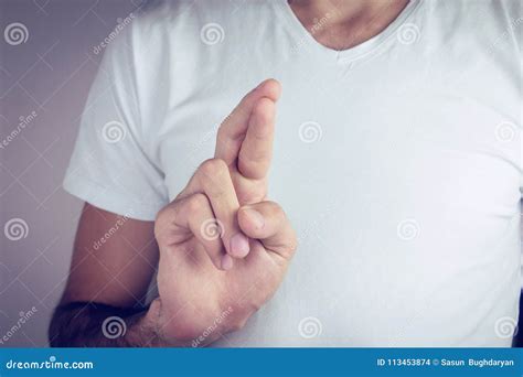 Young Man Swearing An Oath Crossing His Fingers Stock Photo Image Of