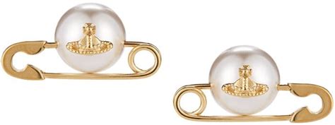 Choker necklaces or pendant necklaces to add a touch of elegance to your looks. Charli XCX Rocks Vivienne Westwood Safety Pin Earrings