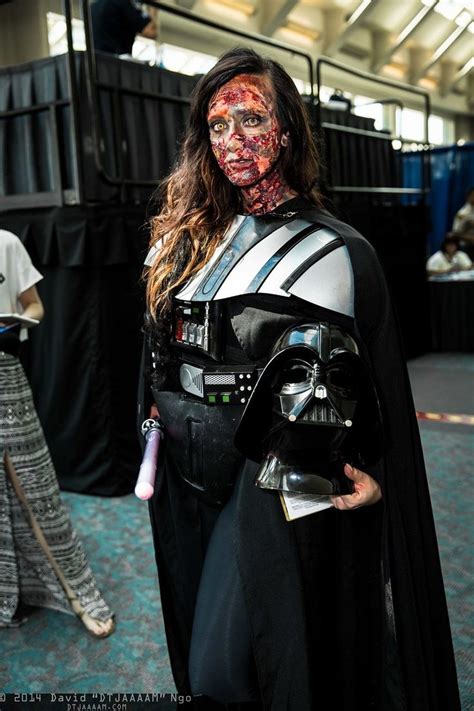 A Woman Dressed Up As Darth Vader With Blood On Her Face