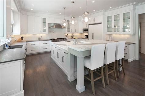 Go down to the absolute minimum as seen in this l shaped kitchen area to save space. small kitchen with two seat marble L shaped island at ...
