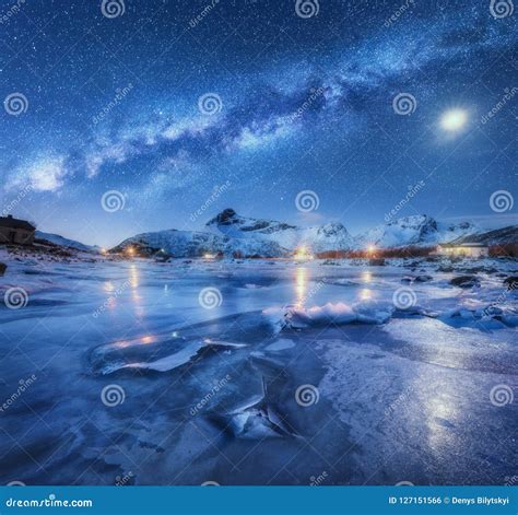 Milky Way Above Frozen Sea Coast Snow Covered Mountains Stock Photo